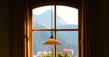 hanging lamp in front of windo in dark room