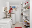 utility room with water heater
