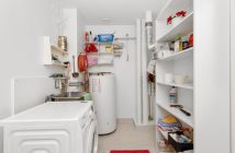 utility room with water heater