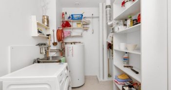 utility room with water heater