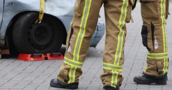 closeup of legs of firefighters at accident scene