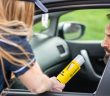 breathalyzer test on man in car