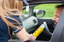 breathalyzer test on man in car