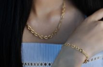 close-up of woman with gold necklace and bracelet