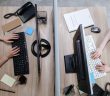 overhead shot of office workers at desk working on PCs