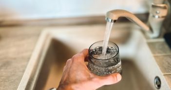 getting glass of water from faucet