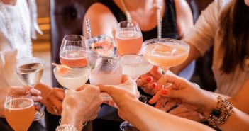 women doing toast with cocktails