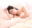 pretty woman sleeping in bed