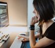 side view of woman working at computer