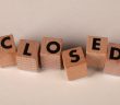 wooden blocks spelling out CLOSED