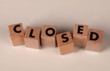 wooden blocks spelling out CLOSED
