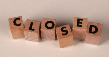 wooden blocks spelling out CLOSED