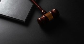 wooden gavel and book