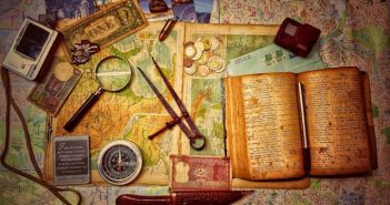 brown wooden scissors and book