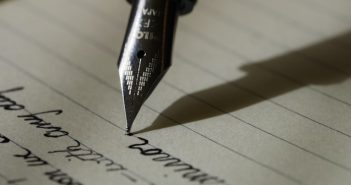 writing on paper with a fountain pen