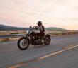 man on motorcycle on road