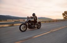 man on motorcycle on road