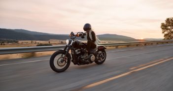 man on motorcycle on road