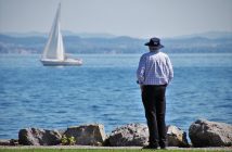 man looking at water