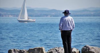 man looking at water