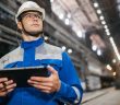 man in hardhat on factory floor
