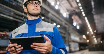 man in hardhat on factory floor