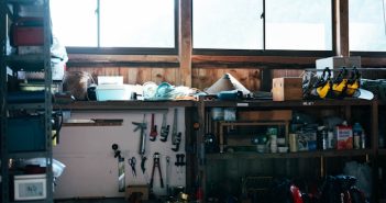 A man relaxing in a home garage workshop on a weekend afternoon