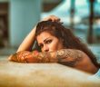 woman with arm tattoo