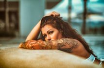 woman with arm tattoo