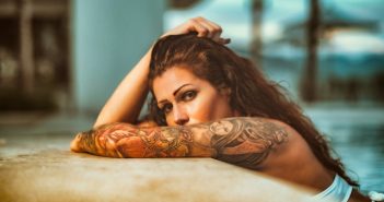 woman with arm tattoo