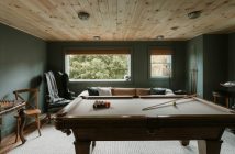 pool table in room with windows