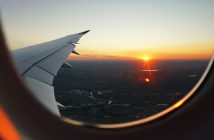 view of sunrise from plane window