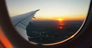 view of sunrise from plane window