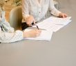 close-up of female attorney with female client at table