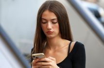 attractive brunette woman using smartphone