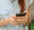 close-up of woman holding smartphone