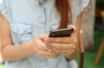 close-up of woman holding smartphone