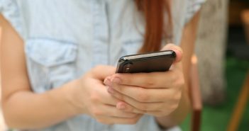 close-up of woman holding smartphone