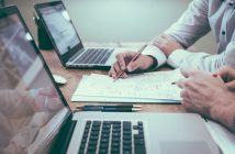 accountants working with paper and laptops