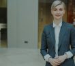 female attorney in gray suit and short blonde hair