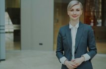 female attorney in gray suit and short blonde hair